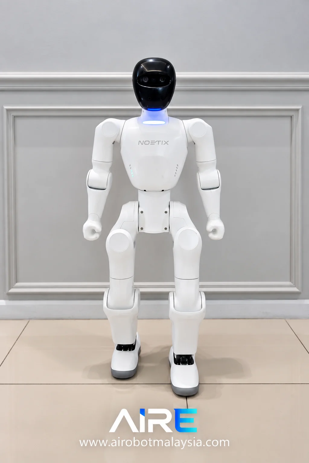 White Noetix Bumi humanoid robot standing indoors