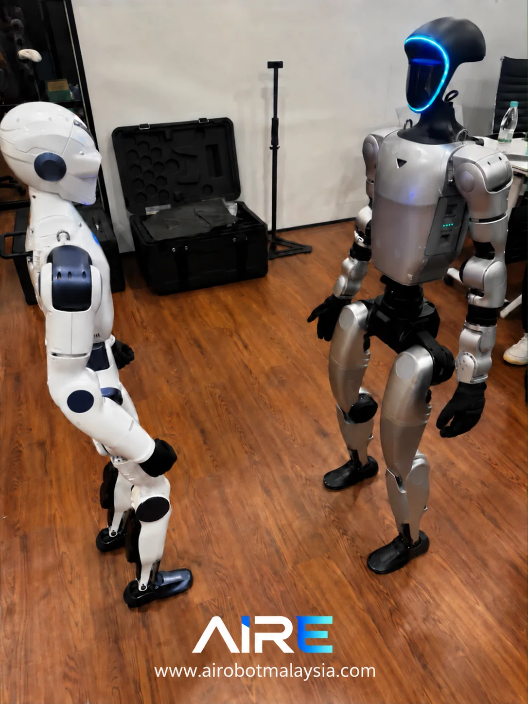 Unitree G1 and R1 humanoid robots in a studio