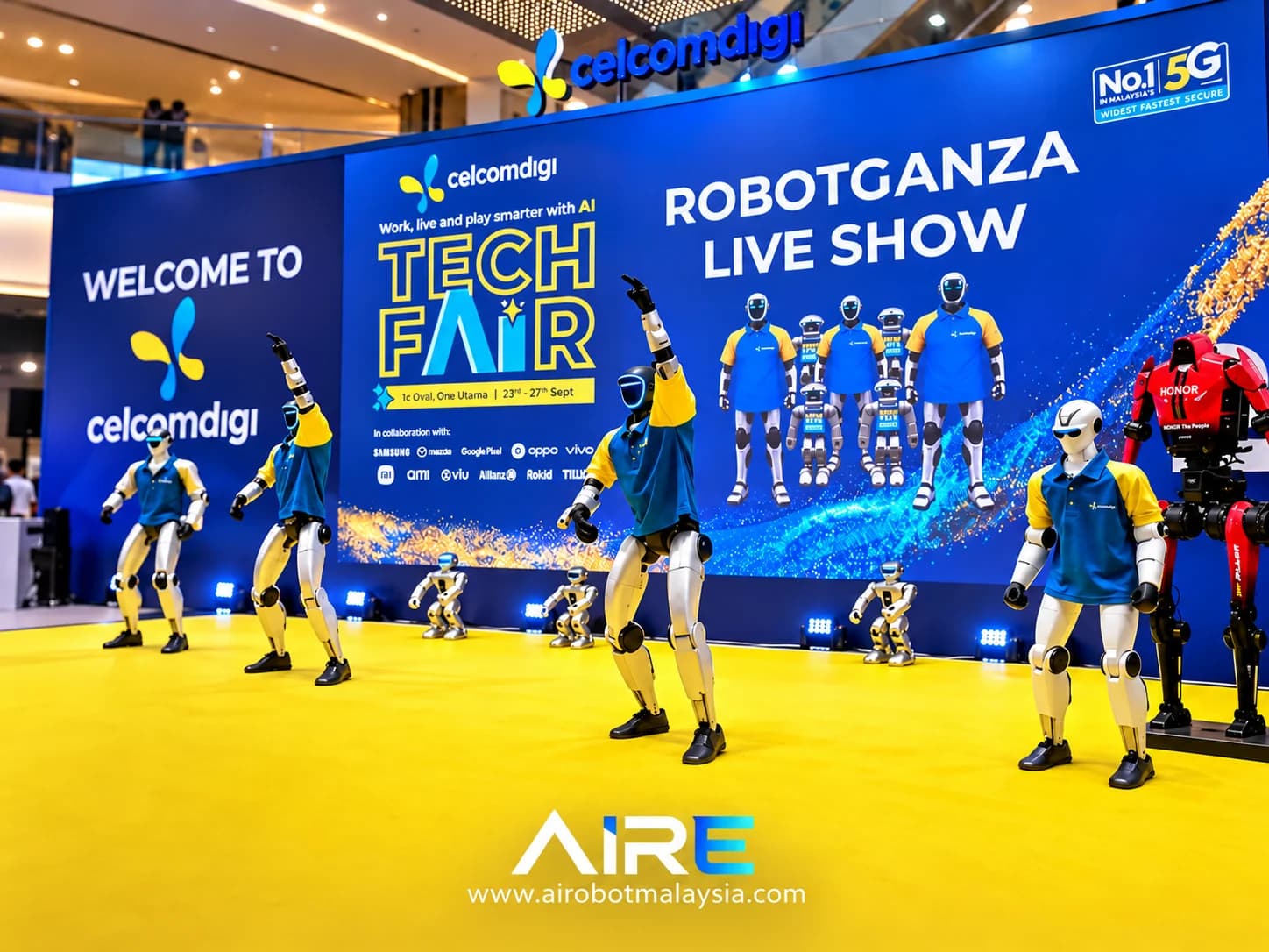 Unitree G1 robots performing on the CelcomDigi Tech Fair stage
